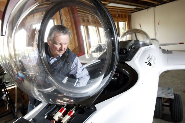 Graham Hawkes stands next to the DeepFlight Super Falcon, a two-person submersible vessel that his company sells. Photo: Michael Short, The Chronicle